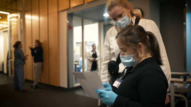 Student from Riverview works with healthcare professionals in hospital.