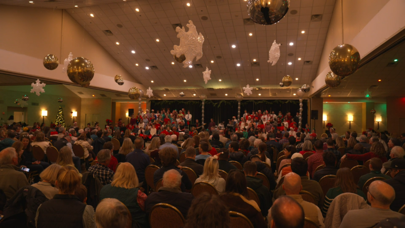 A crowd watches students from Riverview School perform songs.