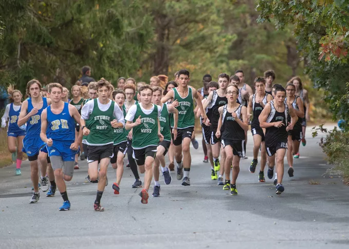 Several teams of students from different schools participating in a race.
