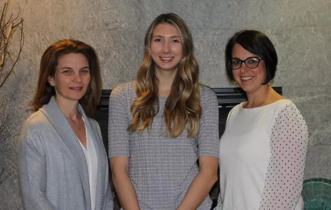 Three women posing for a photo